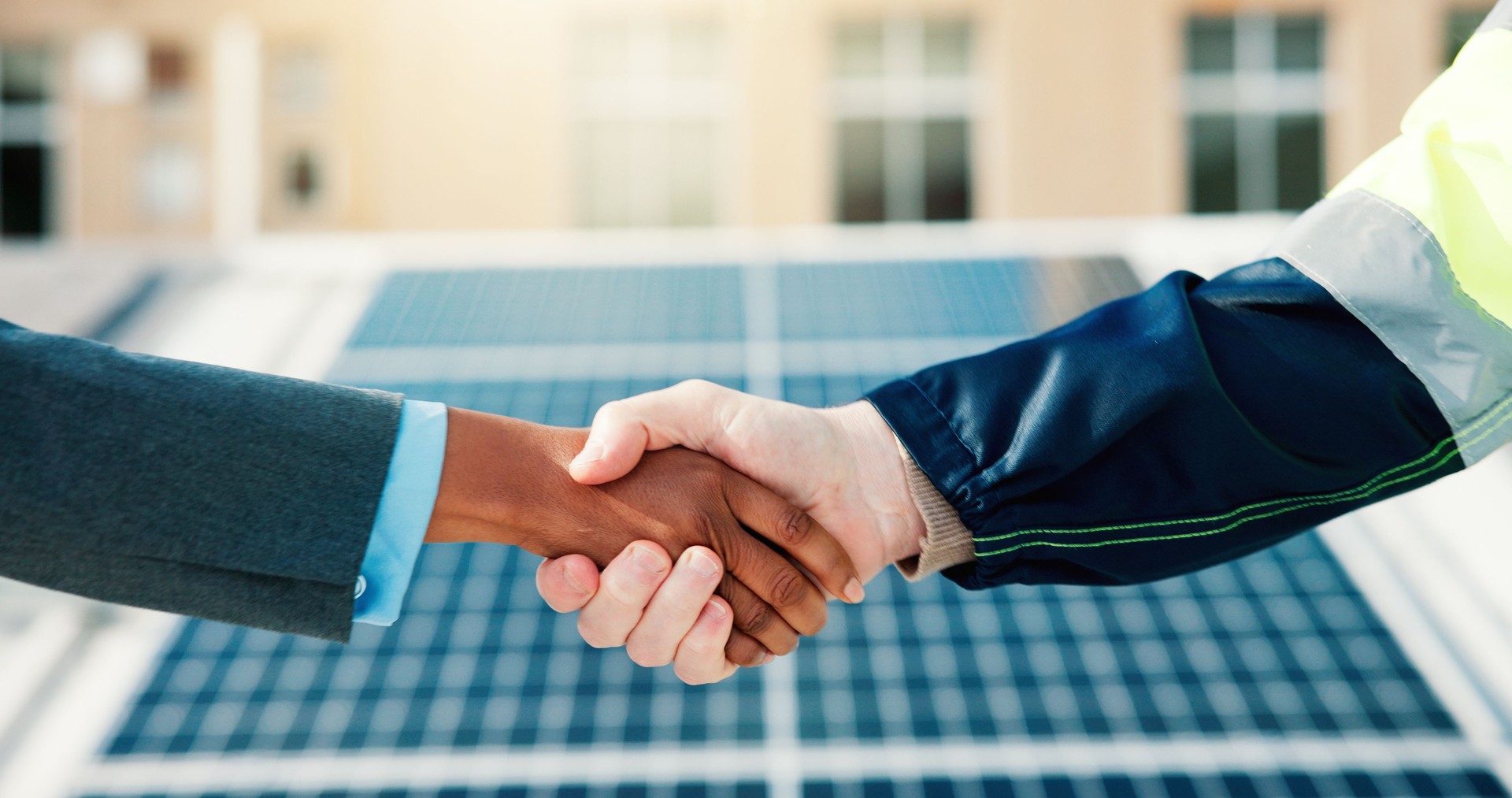 Solar panel, sustainability and handshake for clean energy partnership, renewable resource or eco friendly power. People, shaking hands and photovoltaic for electricity with engineering team outdoor